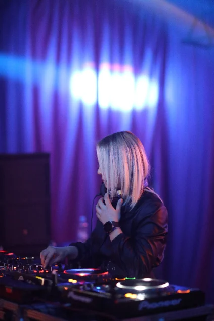 Event image — dark studio, decks